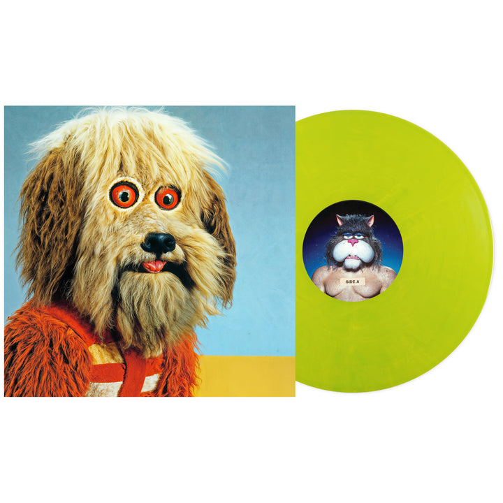 A neon yellow Four Year Strong limited edition vinyl sits by its album cover, featuring a person in a retro dog costume with red eyes and orange fur. The label shows a muscular cartoon cat and Surge Marble track list.