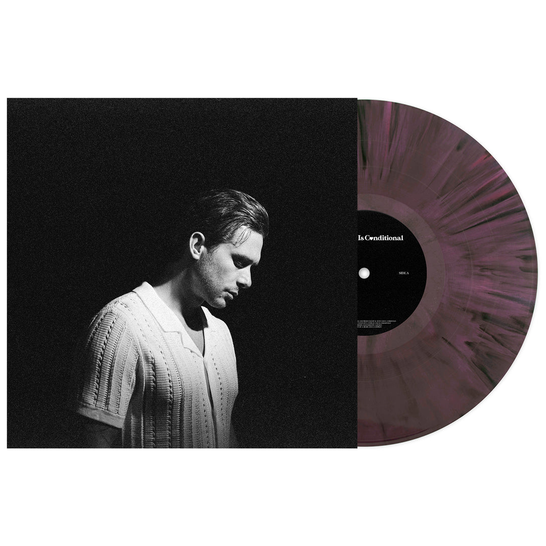 A marbled dark purple-and-black vinyl by K. Soto, partially out of its sleeve, shows a black-and-white photo of K. Soto in a light shirt looking down; the record includes tracks like Your Love Is Conditional.