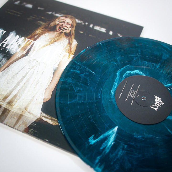 Blue vinyl record with a black label and a person on the cover