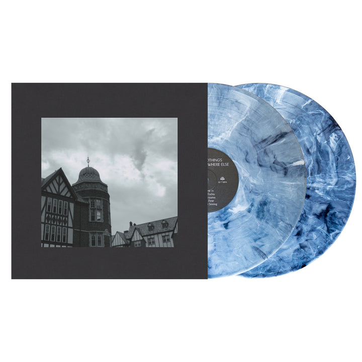 Two marbled blue vinyl records from Cloud Nothings, with a detailed tracklist, are partially slid out from a square album cover featuring a grayscale photo of buildings and a turret under a cloudy sky, all bordered in thick black.