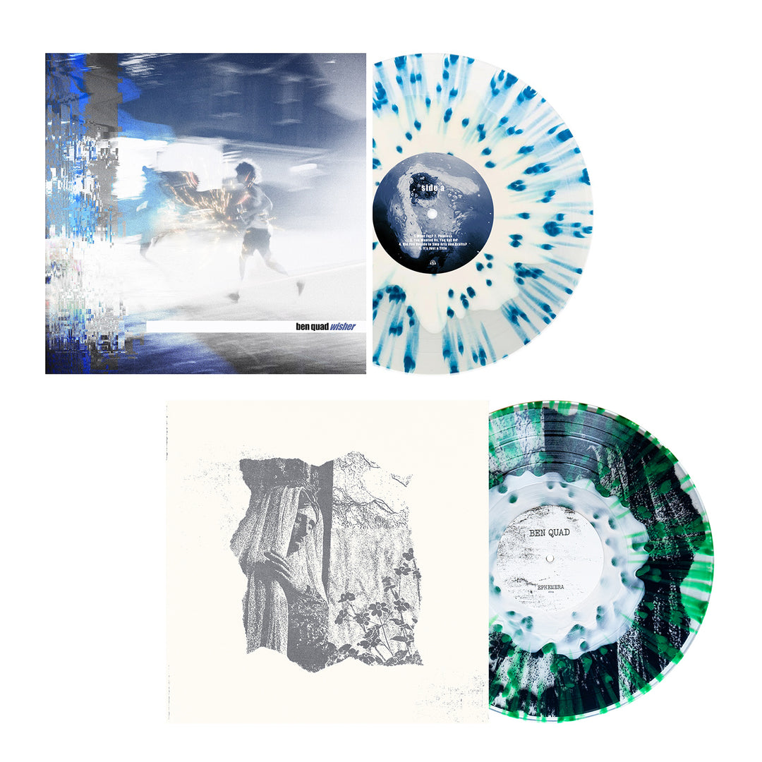 Two colored splatter LPs from Ben Quad: the top is bone-in-clear with blue/black splatters and a blurred abstract figure cover; the bottom is white with green/black splatters and a textured grayscale sleeve design.