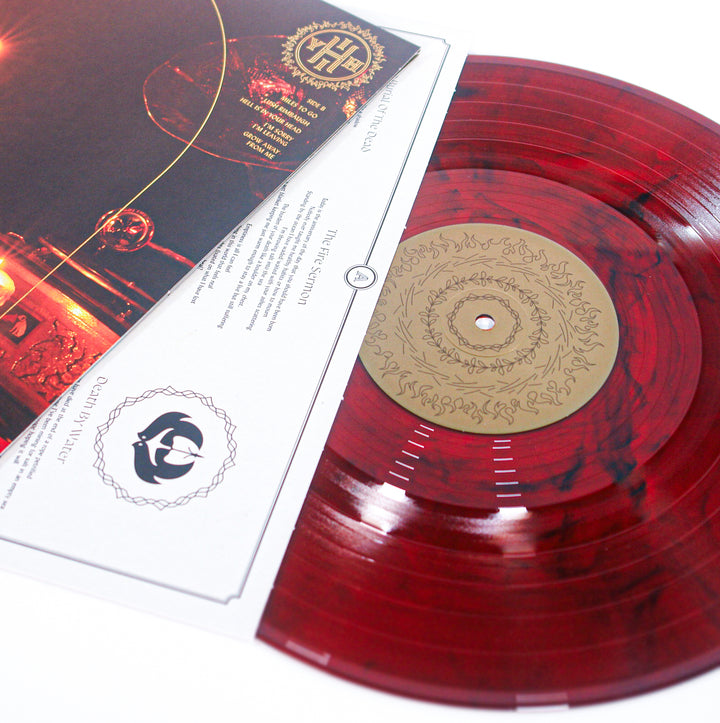 A red marbled vinyl record from Senses Fail with a gold label, partially in its white sleeve, rests beside an ornate Hell Is In Your Head album cover on a bright white background.