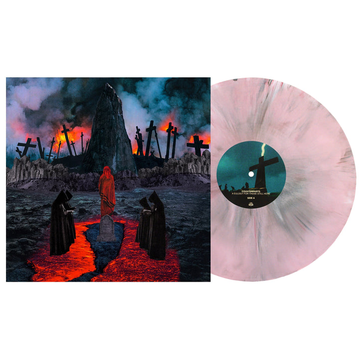 A Counterparts vinyl record in marbled pink, white, and oxblood sits by its album cover featuring a fiery apocalyptic graveyard with graves, crosses, dark-robed figures, and a red-cloaked person.