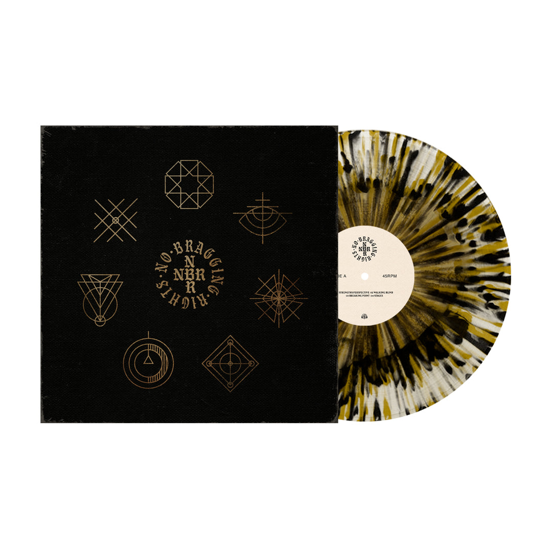 A black sleeve with gold geometric designs and No Bragging Rights in a circle sits beside a Black & Gold Splatter vinyl by No Bragging Rights, partially pulled out to reveal its eye-catching marbled pattern.
