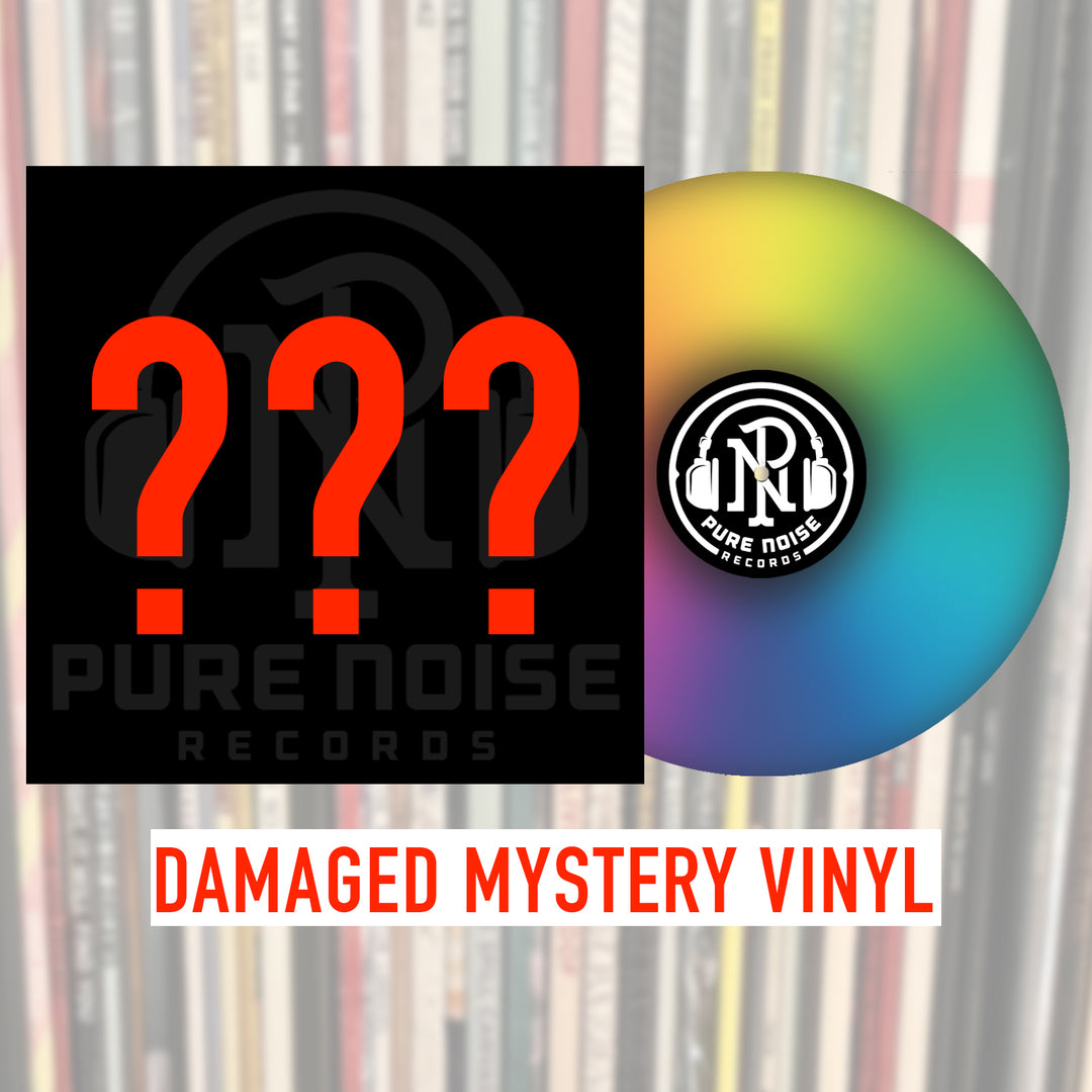 A multicolored gradient vinyl record sits beside a black square with red question marks and the Pure Noise Records logo. Below, red text reads: DAMAGED MYSTERY VINYL—limited edition Pure Noise Records with possible cosmetic damage.