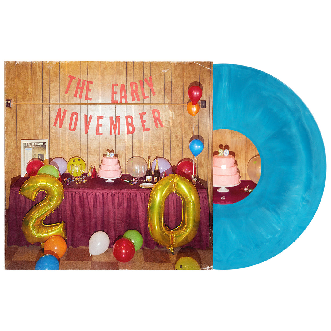 A turquoise Exclusive Limited Edition vinyl from The Early November sits next to an album cover showing a festive table with cakes, balloons, and a THE EARLY NOVEMBER banner. Large gold balloons form the number “20”.