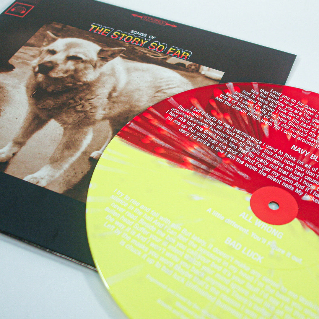 A Yellow Bone Splatter and Half Blood Red vinyl rests on an album cover with a sepia dog photo. "Songs Of The Story So Far" appears in colorful text at the top. Brand: The Story So Far.