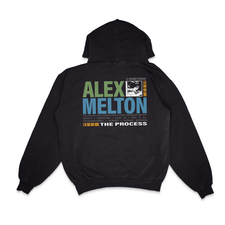 This black Alex Melton Gildan Heavy hoodie features vibrant green and blue "Alex Melton" text on the back, a small grayscale photo, and additional white "The Process" text near the bottom—a standout piece for fans.