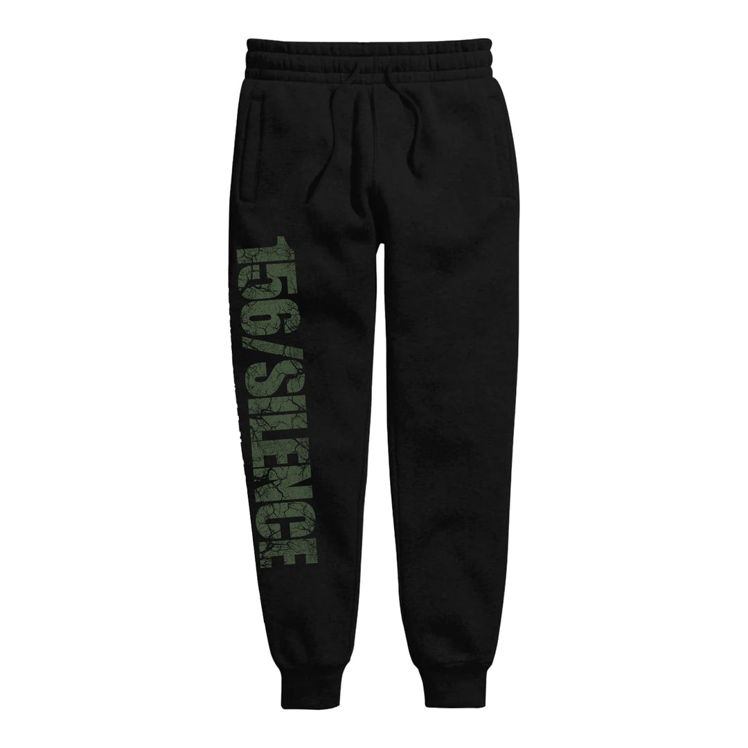 156/Silence black sweatpants feature an elastic waistband with drawstring, cuffed ankles, side pockets, and bold distressed green 156/Silence text down the left leg—ideal for pairing with your favorite sweatshirt.