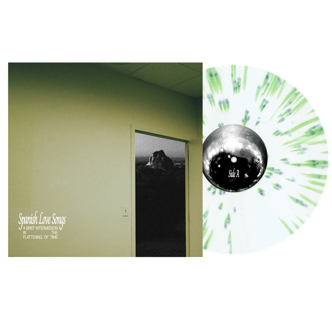A Spanish Love Songs Vinyl LP with a white and green splatter design is partly in its sleeve, which displays a dim room leading to a black-and-white scene. Text reads: Spanish Love Songs—A Brief Intermission In The Flattening Of Time.