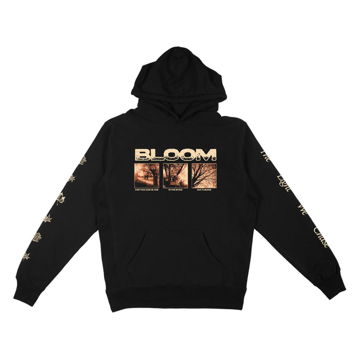 Black Bloom hoodie with BLOOM text and three sepia tree photos on the front, floral graphics and text down both sleeves, drawstring hood, and front pocket. Inspired by Back To Belrose womens fashion.