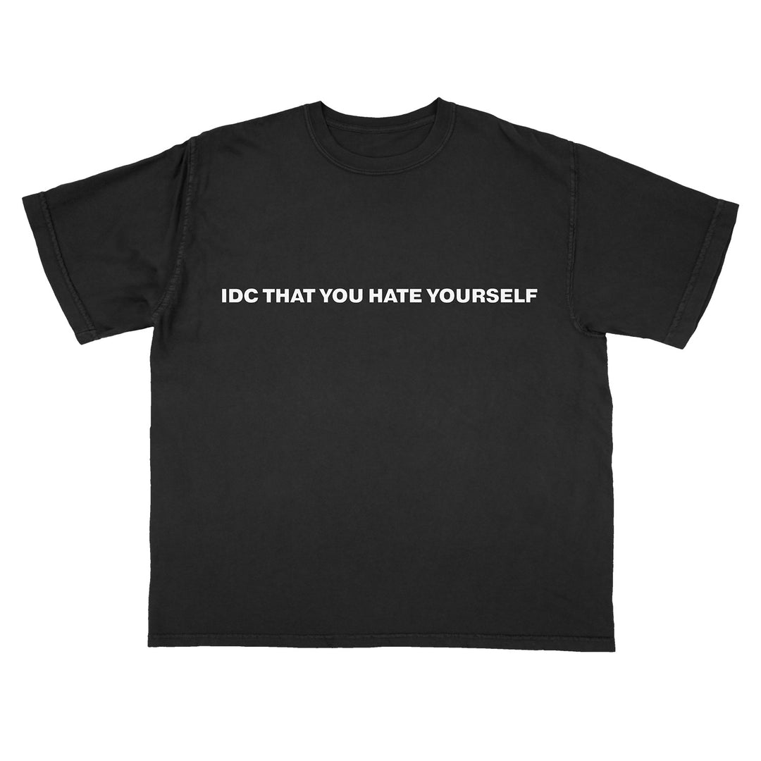 A black Knocked Loose t-shirt with "IDC THAT YOU HATE YOURSELF" printed in bold white capital letters across the chest.
