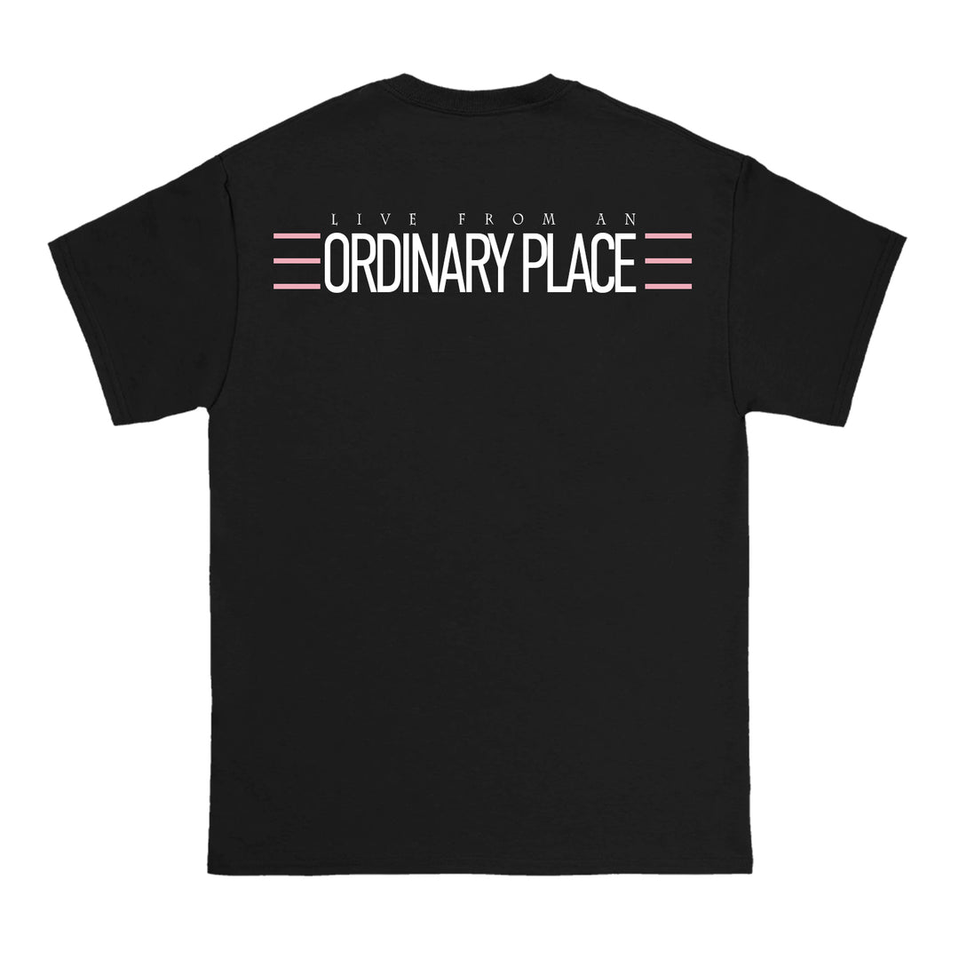 Anthony Family black T-shirt featuring LIVE FROM AN ORDINARY PLACE in white text, with pink and white lines above and below ORDINARY PLACE on the back.