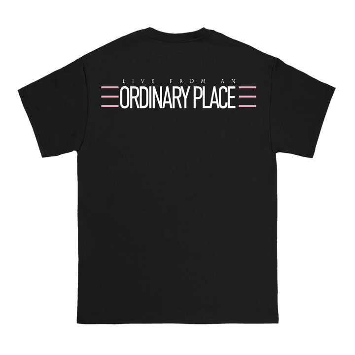 Anthony Family black T-shirt featuring LIVE FROM AN ORDINARY PLACE in white text, with pink and white lines above and below ORDINARY PLACE on the back.