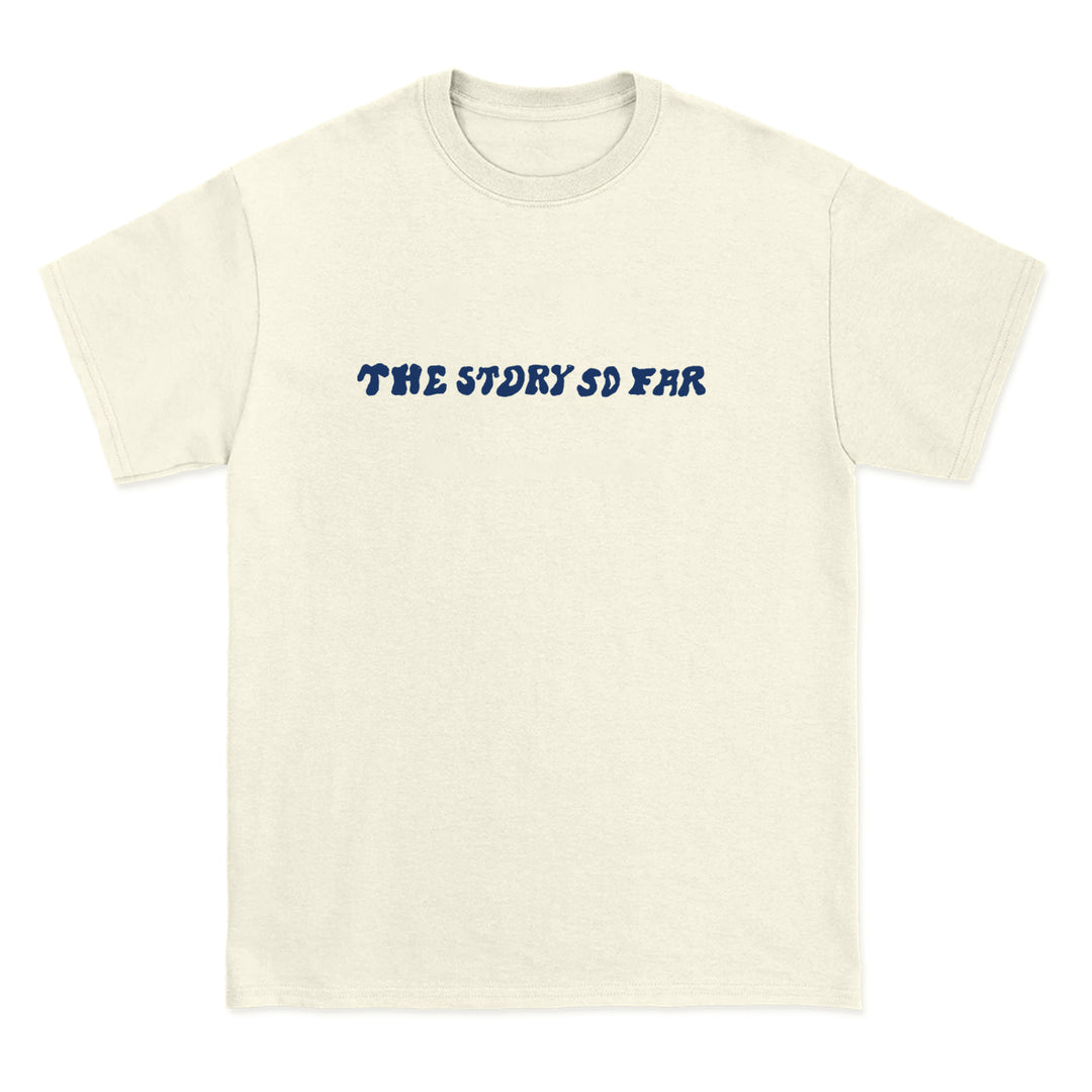 A Comfort Colors off-white tee from The Story So Far, featuring the band name in bold wavy blue letters across the chest—a must-have for fans of branded merchandise.