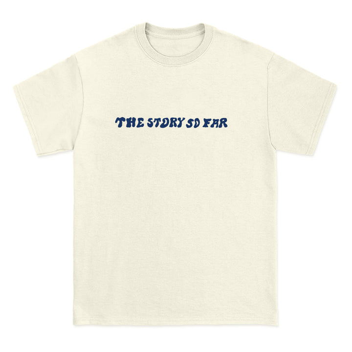 A Comfort Colors off-white tee from The Story So Far, featuring the band name in bold wavy blue letters across the chest—a must-have for fans of branded merchandise.