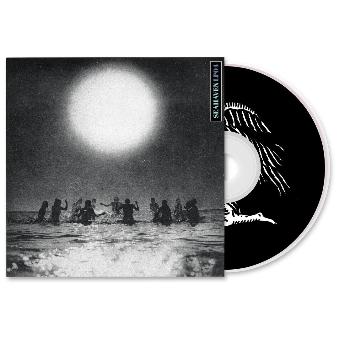 A CD partially out of its case shows Seahaven's black and white cover art with silhouetted figures in water beneath a large sun; the CD features a white abstract design on a black background.