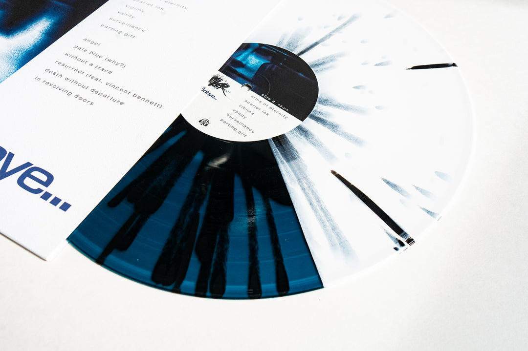 A Chamber "This Is Goodbye" Black in Sea Blue splatter vinyl LP rests partly in a white sleeve with blue text and printed tracklist. The presale record features a labeled center with text and a blurred monochrome image.