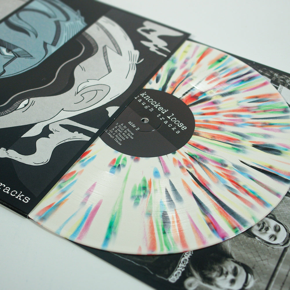 This limited edition 17th Press vinyl by Knocked Loose features a Bone with Rainbow Splatter design, partially in its sleeve, displaying bold black and white artwork with "Knocked Loose - A Different Shade of Blue.