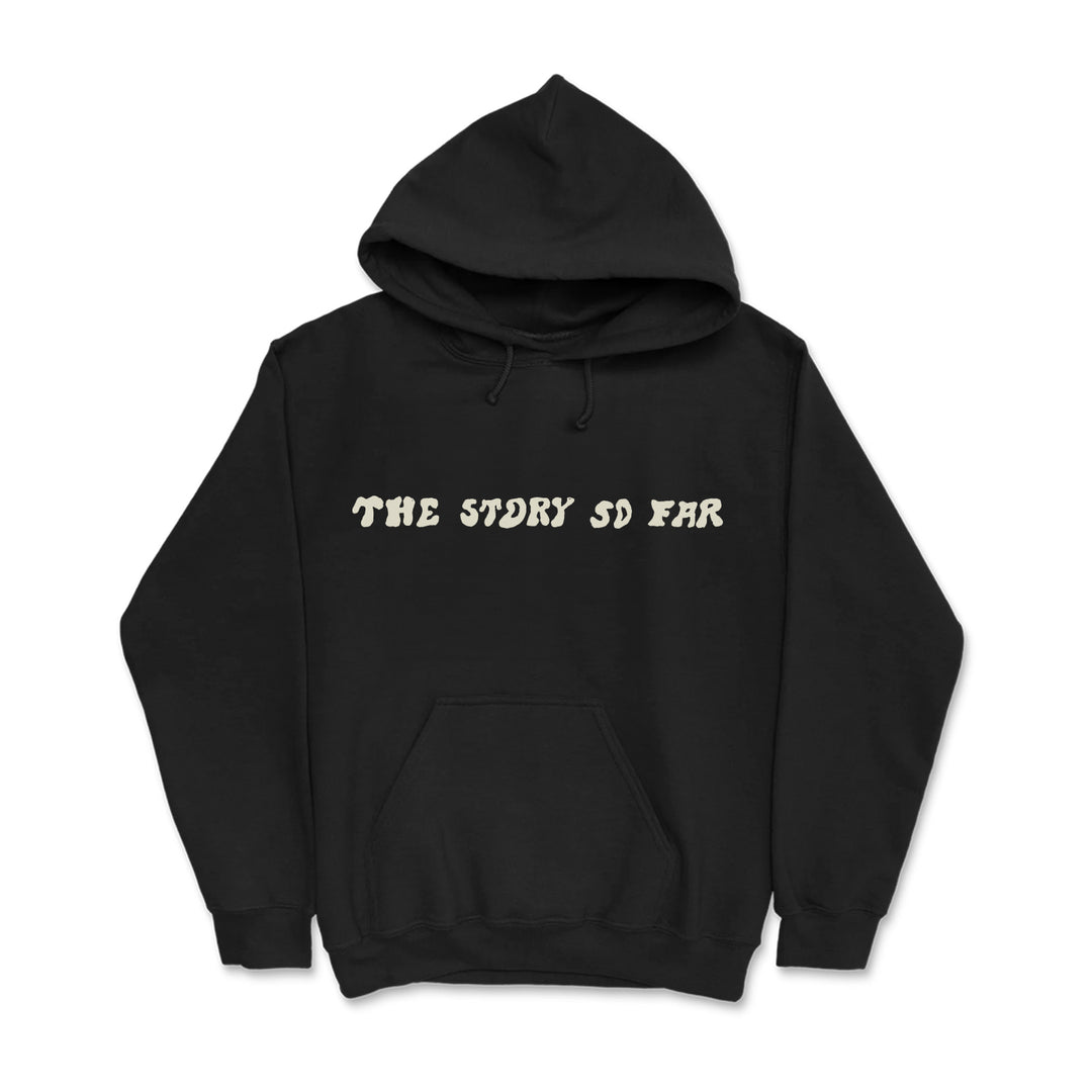 A black pullover hoodie from The Story So Far, featuring bold cream lettering across the chest and a front pocket.