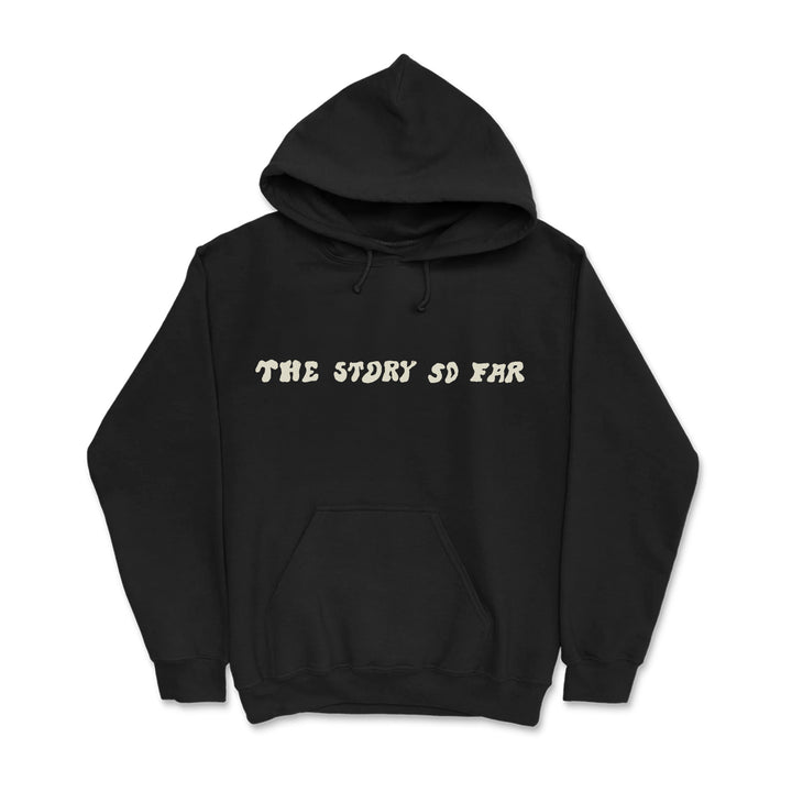 A black pullover hoodie from The Story So Far, featuring bold cream lettering across the chest and a front pocket.