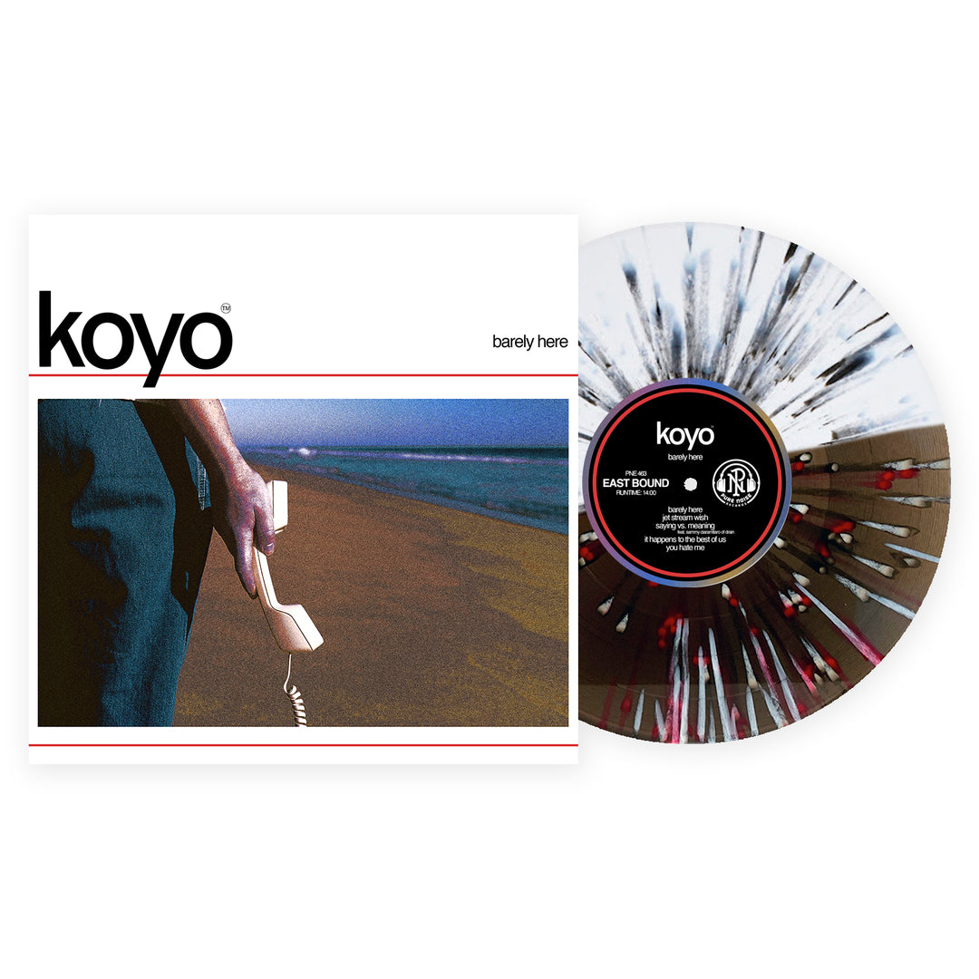 A KOYO Barely Here vinyl with black and red splatter sits next to its cover, which features a close-up of a hand holding a disconnected phone receiver on a beach. This exclusive variant is from the album Barely Here by KOYO.