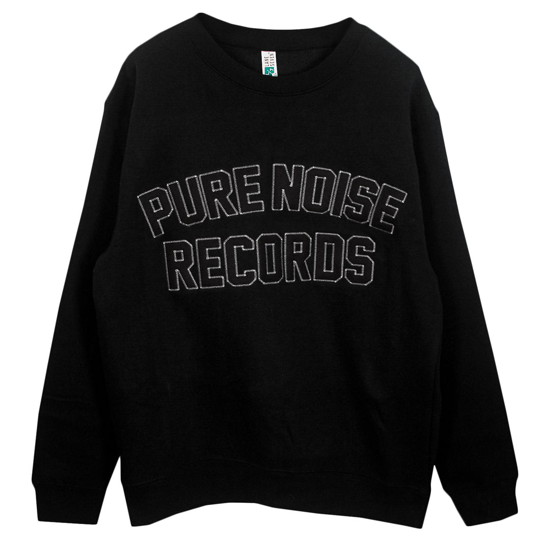 A black Pure Noise Records Merch crewneck sweatshirt featuring PURE NOISE RECORDS in bold, white-outlined letters across the chest.