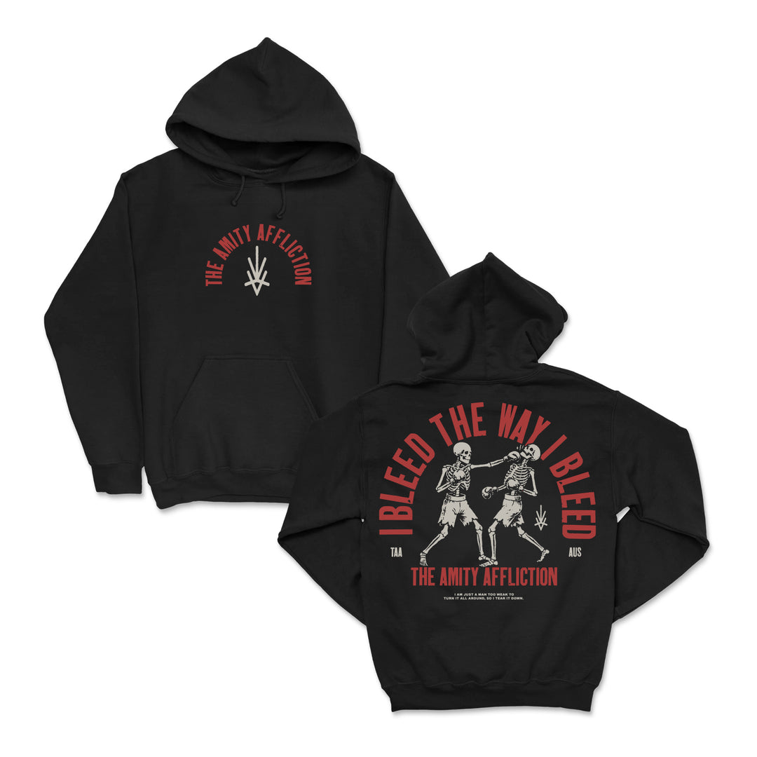 Black Gildan hoodie by The Amity Affliction with a small front symbol and back graphics of two skeletons fighting, surrounded by bold red and white "Bleed The Way I Bleed" and band logo.