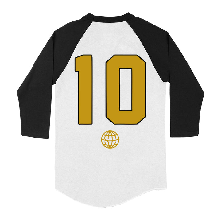 A State Champs Tultex baseball-style shirt featuring a white body, black sleeves, a bold gold number 10, and a small gold globe icon beneath it on the back.