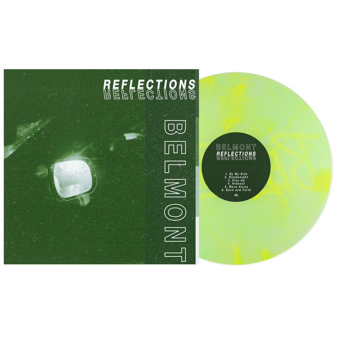 A green vinyl record of Reflections by Belmont beside its album cover, which shows a dark green, grainy image with a car mirror and bold white text that looks etched into marble.