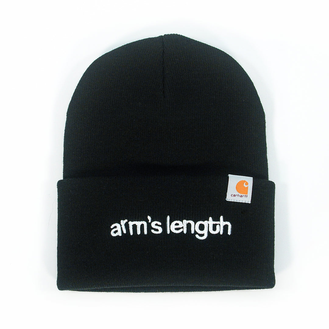 A black Arm's Length beanie with "arms length" embroidered in white lowercase on the front fold and a small Carhartt logo tag on the right—a classic choice for fans of embroidered beanies.
