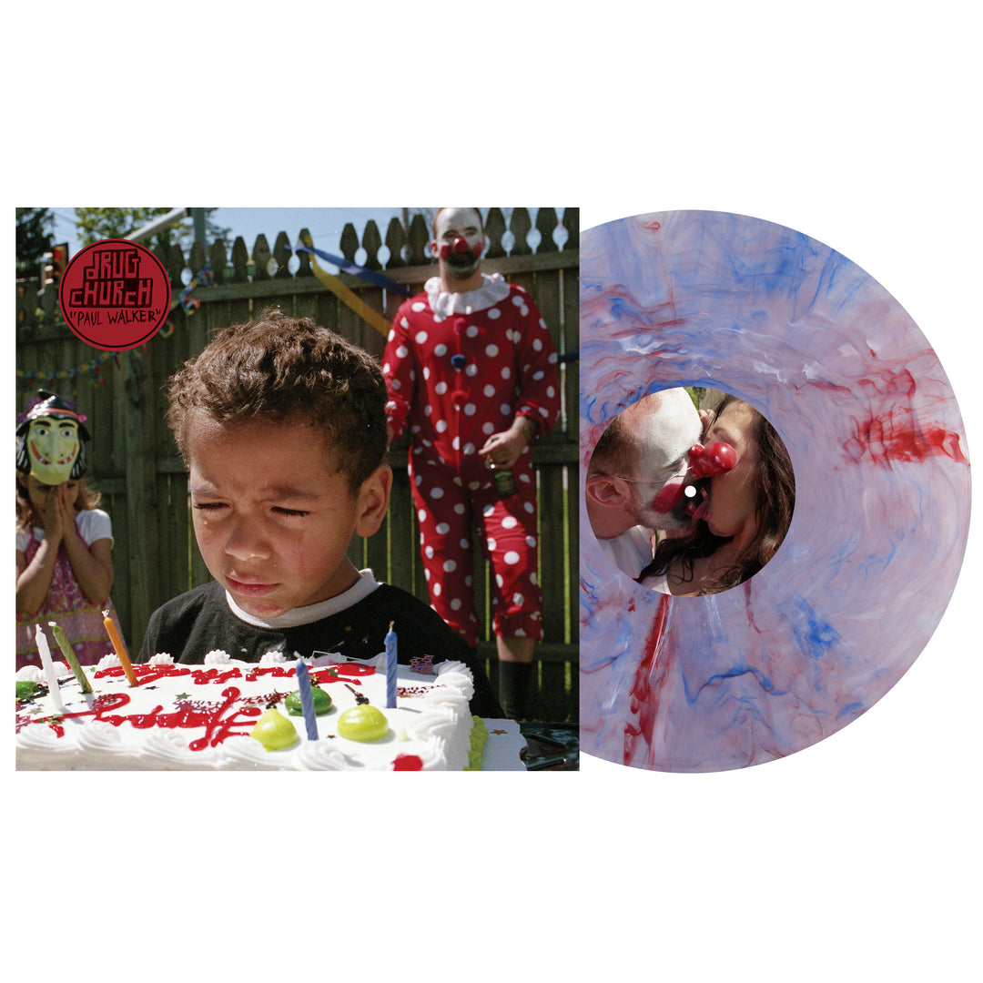A young boy stands upset before a candlelit cake, with two clowns behind him. Next to the scene is a blue and pink marble vinyl LP from Drug Church—a unique offering for this album presale.