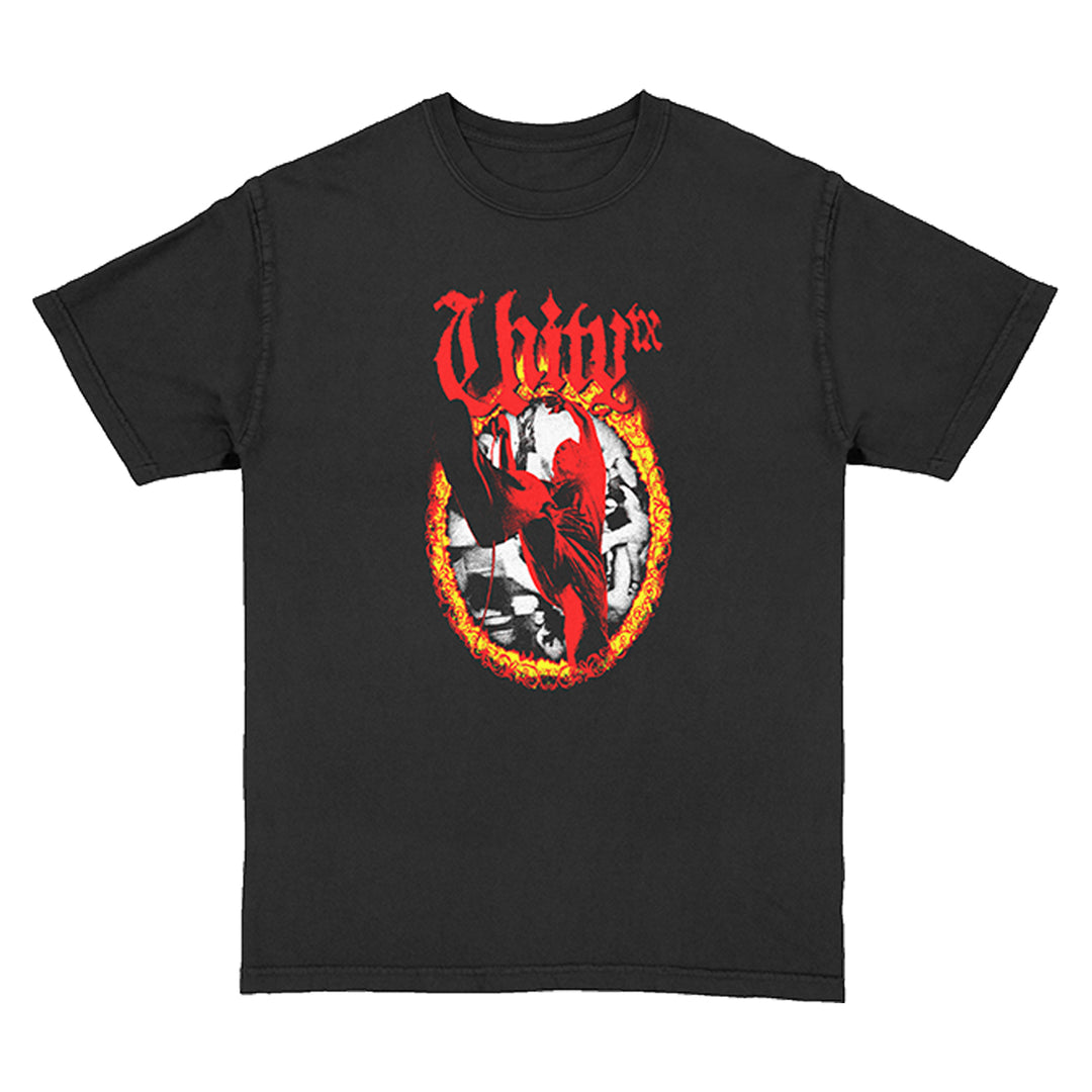 UNITYTX black Comfort Colors shirt with a graphic of a red figure inside a flaming oval, set on a black and white checkerboard background, topped with bold red stylized text.