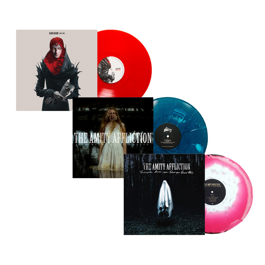 Three The Amity Affliction vinyl records: Blood Red LP with a red and black figure, Blue Marble LP with a white-clad person, and Pink-and-White Splatter LP featuring a hooded figure in black and white.