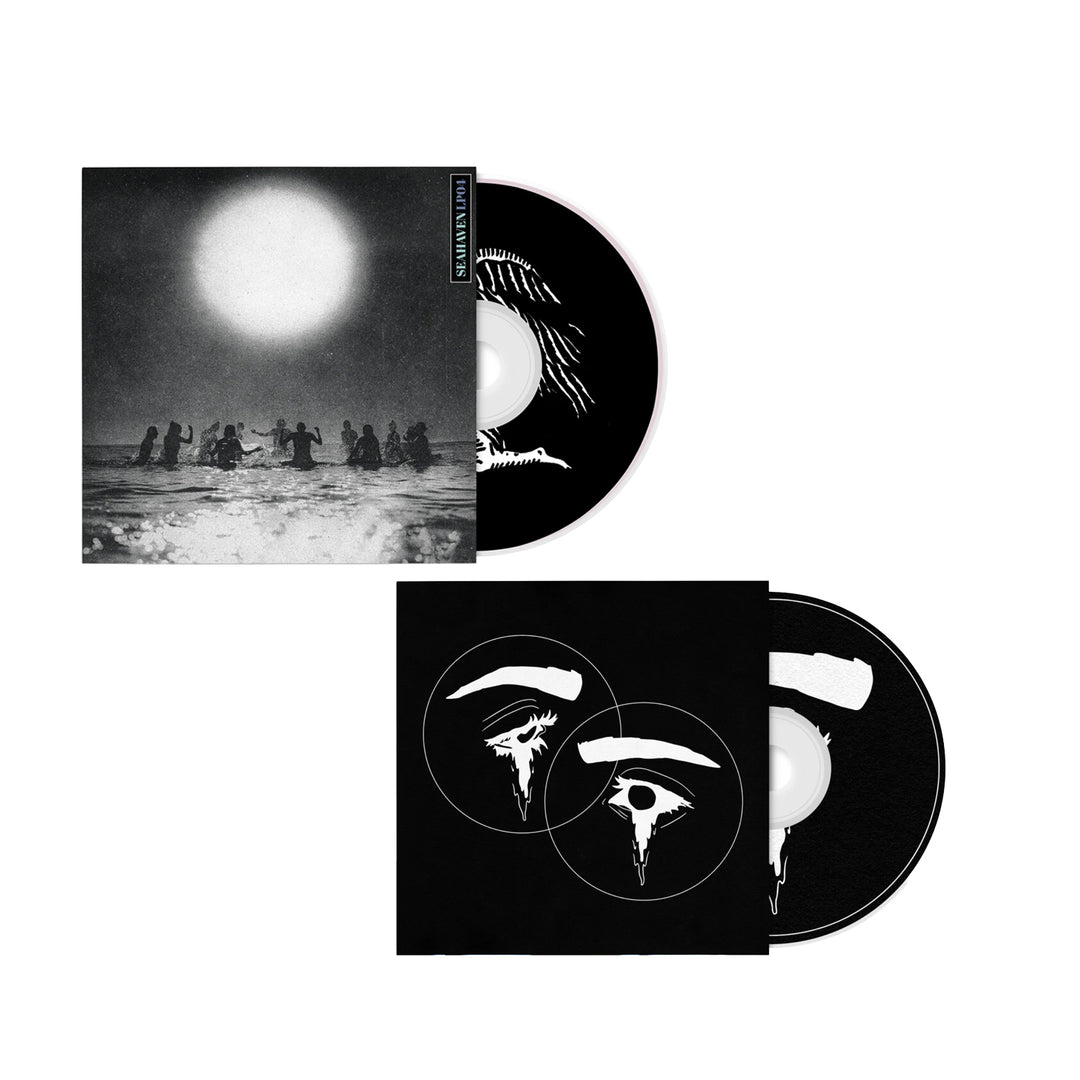 Two Seahaven CD albums with black and white cover art: the top shows people in water under a large sun; the bottom features abstract overlapping circles. Both CDs are partly out of their cases, displaying matching art.