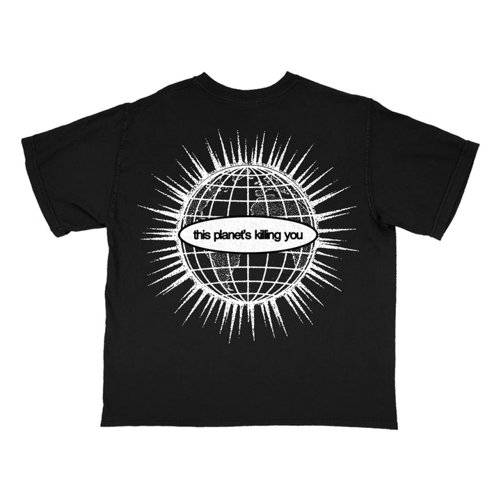 Comfort Colors black t-shirt featuring a white graphic of a globe with radiating lines and a central banner that reads, this planets killing you.