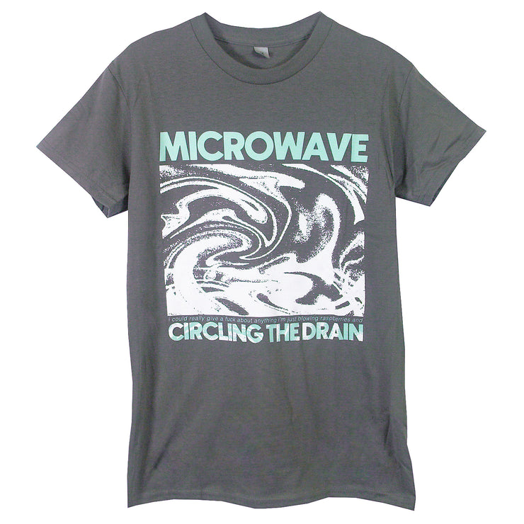 image of a charcoal tee shirt on a white background. tee says microwave circling the drain with white swirls in the center
