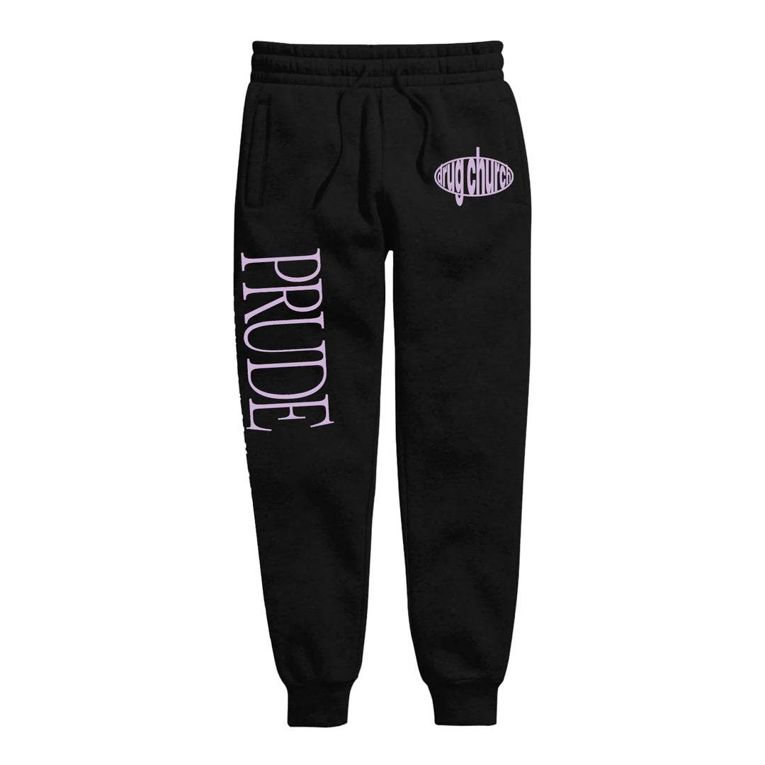 Black jogger sweatpants by Drug Church featuring PRUDE in large, light purple letters down the left leg and an oval "STAY CHOOSE" logo on the right hip—great to pair with your favorite printed sweatshirt or custom apparel.