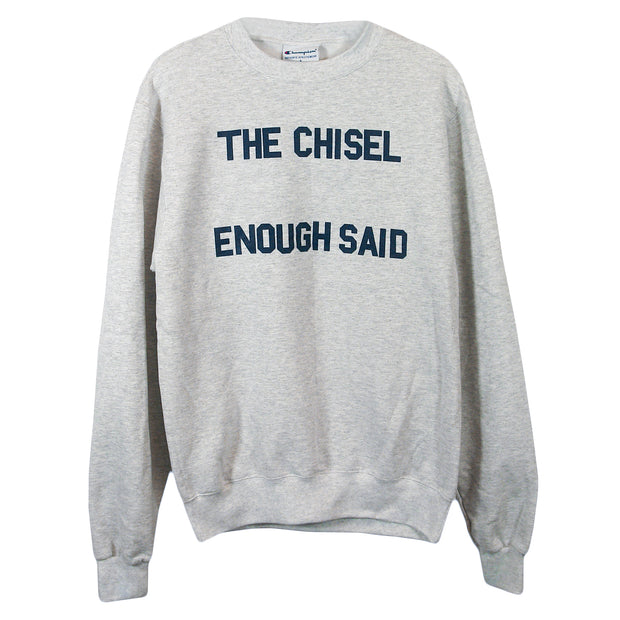 image of a heather grey crewneck sweatshirt on a white background. printed on the front in blue says the chisel enough said