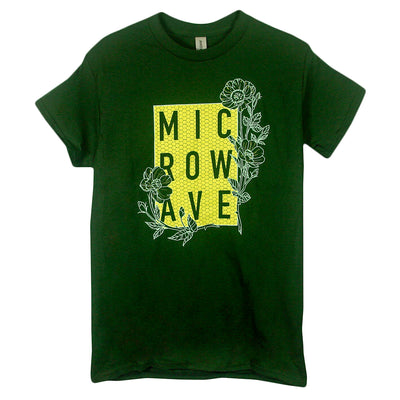 image of a forest green tee shirt on a white background. tee has center print that says microwave with flowers around it