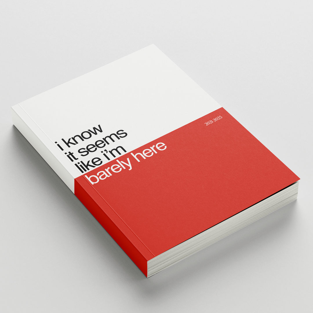 A KOYO photo book titled "Barely Here" (2023-2024), featuring a red and white cover, rests on a white surface—offering behind-the-scenes insights into its creation.