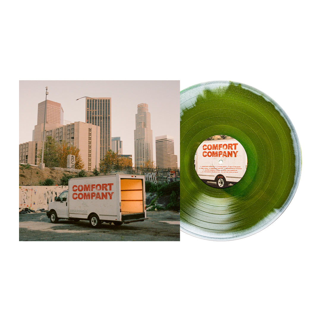A green Bearings vinyl sits next to an album cover featuring a box truck painted with Bearings, parked before city buildings at sunset—don’t miss the glitter vinyl LP album presale.