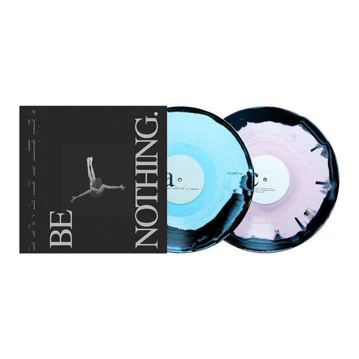Two vinyl records—one blue and one purple—partially slide out of a black-and-white album cover that reads "BE NOTHING." with an image of a person diving in the center, creating a striking Boston Manor vinyl pressing celebrating the 10-year anniversary of their *Be Nothing* album.
