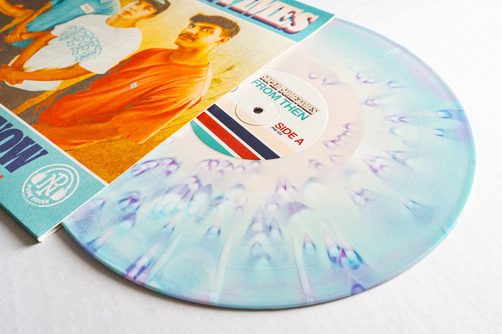 A pastel splatter vinyl from Super Sometimes, with purple and blue hues, slides from its cover showing two people in vibrant art. The label reads SIDE A and From Then—an ideal addition to your colored splatter vinyl collection.