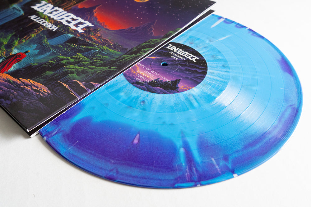 A blue and purple marbled Unwell Allegoria vinyl record slides from a vibrant fantasy landscape cover—ideal for colored splatter LP collectors or album presale fans.