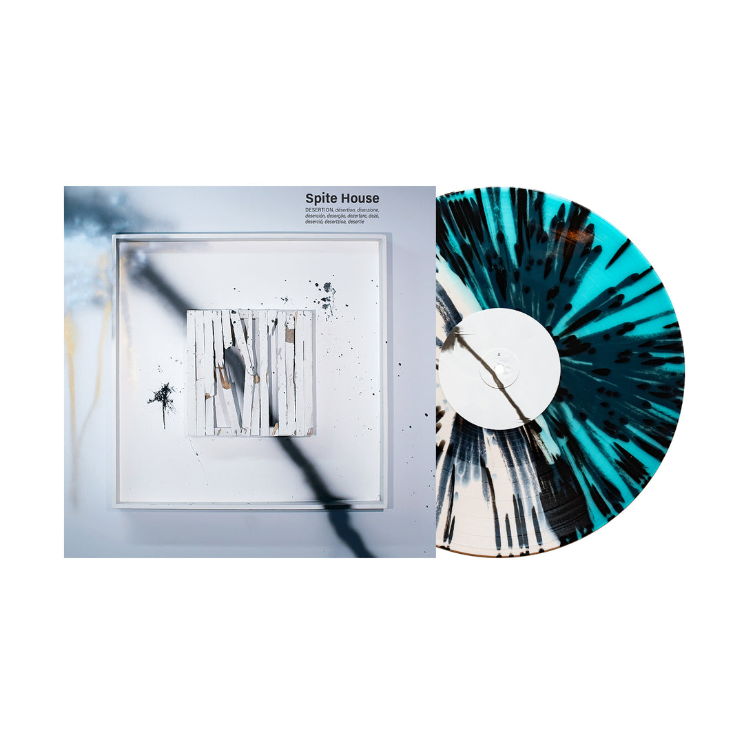 A Desertion Vinyl LP by Spite House features a white base with heavy black splatter and teal accents, shown next to its abstract album cover. The title "Spite House" appears above, highlighting this highly anticipated 2025 release.