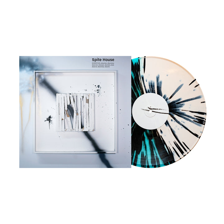 A Spite House "Desertion" Vinyl LP with heavy black splatter is partially pulled from its abstract, paint-splattered album cover—an exciting preview for the Album Release 2025.