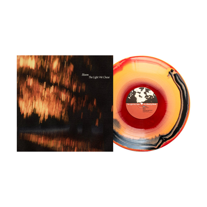 Bloom’s limited edition album "Blush The Light We Chase" comes on red, yellow, and black marbled vinyl beside its cover with an abstract warm-toned image. This collectible presale LP is a must-have for collectors.