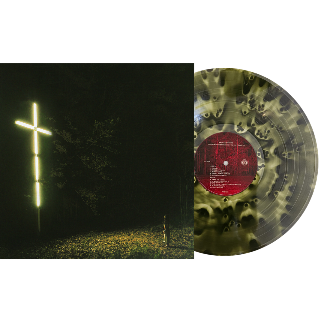 Vinyl record with a black and yellow marbled design, shown next to the Forest Green Ghost 9th press cover art featuring a person standing in a dark forest before a glowing cross.