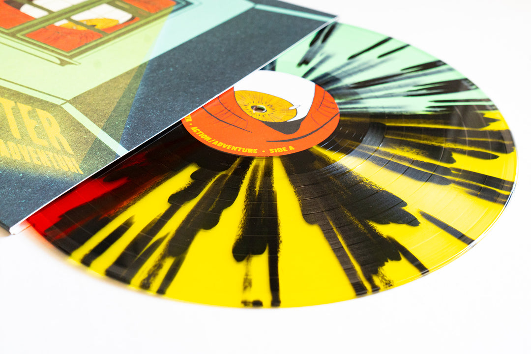 A colored vinyl record with a yellow and black splatter design is partially pulled from a colorful, illustrated album cover by Action/Adventure—an eye-catching addition to your collection.